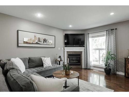 05-193 O'Coffey Crescent, Fort Mcmurray, AB - Indoor Photo Showing Living Room With Fireplace