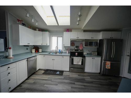 128 Mckinlay Crescent, Fort Mcmurray, AB - Indoor Photo Showing Kitchen With Double Sink