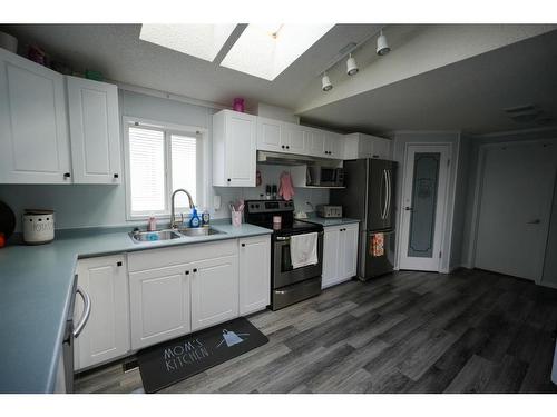 128 Mckinlay Crescent, Fort Mcmurray, AB - Indoor Photo Showing Kitchen With Double Sink