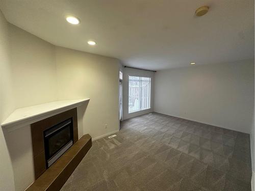 10-97 Wilson Drive, Fort Mcmurray, AB - Indoor With Fireplace