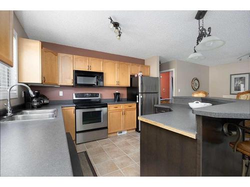 142 Grayling Crescent, Fort Mcmurray, AB - Indoor Photo Showing Kitchen With Stainless Steel Kitchen With Double Sink