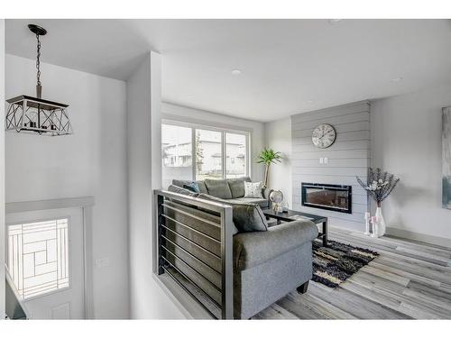 213 Sitka Drive, Fort Mcmurray, AB - Indoor Photo Showing Living Room With Fireplace