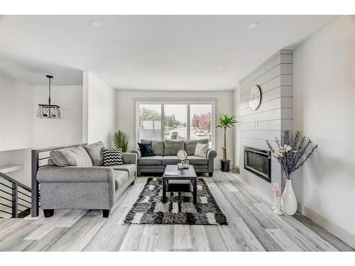 213 Sitka Drive, Fort Mcmurray, AB - Indoor Photo Showing Living Room With Fireplace