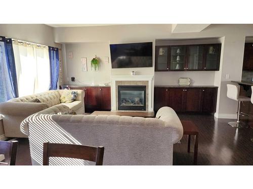 8-313 Millennium Drive, Fort Mcmurray, AB - Indoor Photo Showing Living Room With Fireplace