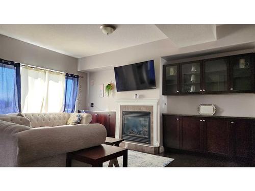 8-313 Millennium Drive, Fort Mcmurray, AB - Indoor Photo Showing Living Room With Fireplace