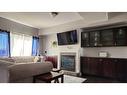 8-313 Millennium Drive, Fort Mcmurray, AB  - Indoor Photo Showing Living Room With Fireplace 