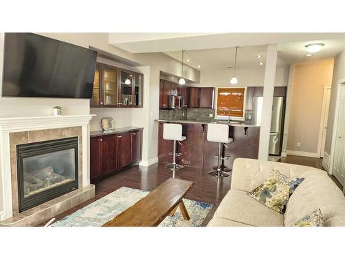 8-313 Millennium Drive, Fort Mcmurray, AB - Indoor Photo Showing Living Room With Fireplace