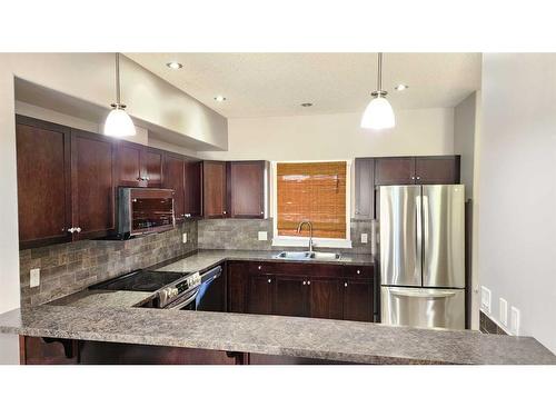 8-313 Millennium Drive, Fort Mcmurray, AB - Indoor Photo Showing Kitchen With Stainless Steel Kitchen With Double Sink