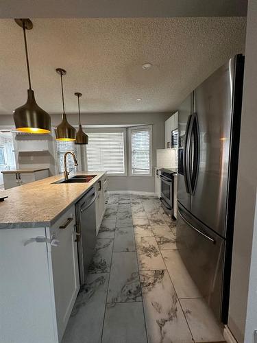 109 Robichaud Street, Fort Mcmurray, AB - Indoor Photo Showing Kitchen With Upgraded Kitchen