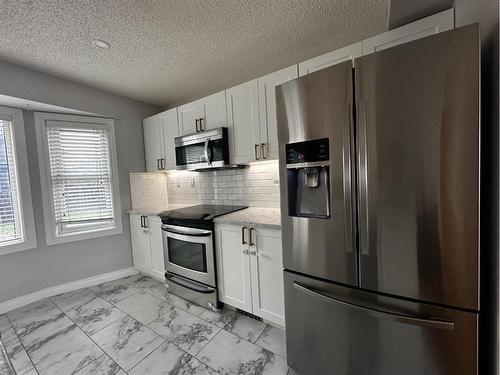 109 Robichaud Street, Fort Mcmurray, AB - Indoor Photo Showing Kitchen