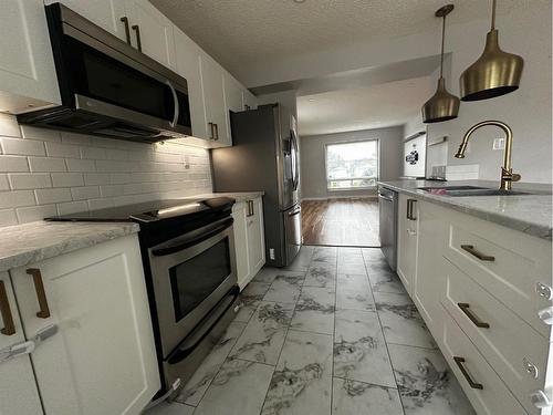 109 Robichaud Street, Fort Mcmurray, AB - Indoor Photo Showing Kitchen With Upgraded Kitchen