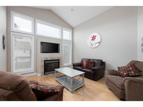 180 Mountain Avens Crescent, Fort Mcmurray, AB - Indoor Photo Showing Living Room With Fireplace