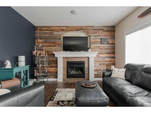 135 Crane Place, Fort Mcmurray, AB - Indoor Photo Showing Living Room With Fireplace