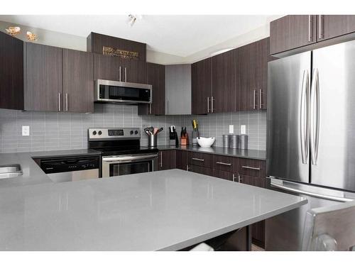 105-401 Athabasca Avenue, Fort Mcmurray, AB - Indoor Photo Showing Kitchen With Stainless Steel Kitchen With Double Sink With Upgraded Kitchen