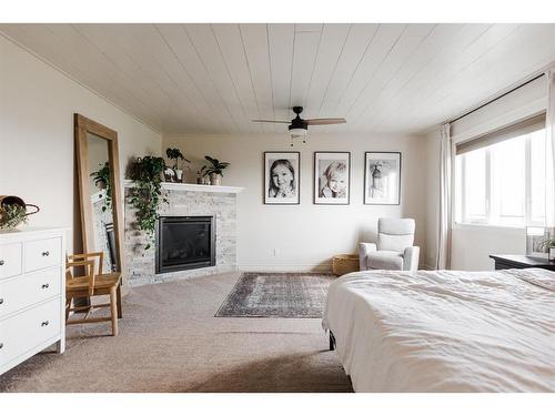 133 Gravelstone Way, Fort Mcmurray, AB - Indoor Photo Showing Bedroom With Fireplace