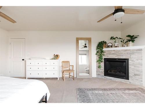 133 Gravelstone Way, Fort Mcmurray, AB - Indoor Photo Showing Bedroom With Fireplace