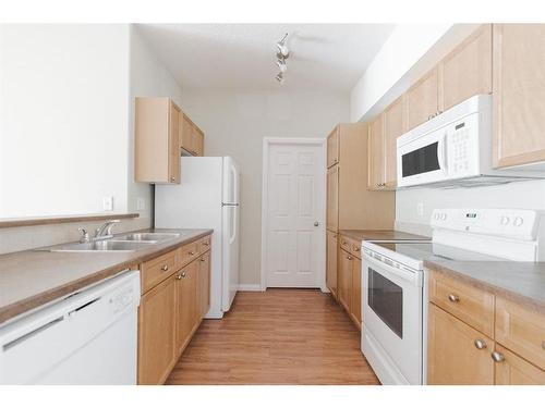 110-290 Plamondon Drive, Fort Mcmurray, AB - Indoor Photo Showing Kitchen With Double Sink