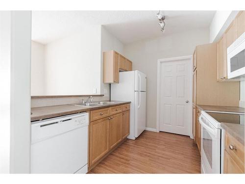 110-290 Plamondon Drive, Fort Mcmurray, AB - Indoor Photo Showing Kitchen With Double Sink