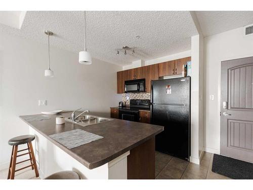 216-136A Sandpiper Road, Fort Mcmurray, AB - Indoor Photo Showing Kitchen With Double Sink