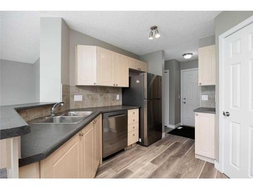 164 Cinnamon Street, Fort Mcmurray, AB - Indoor Photo Showing Kitchen With Double Sink