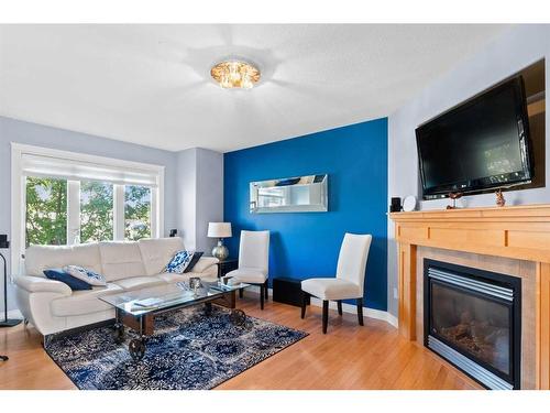 145 Rainbow Creek Drive, Fort Mcmurray, AB - Indoor Photo Showing Living Room With Fireplace