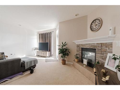 26-98 Wilson Drive, Fort Mcmurray, AB - Indoor Photo Showing Living Room With Fireplace