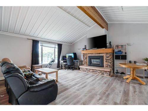 52 Poplar Crescent, Gregoire Lake Estates, AB - Indoor Photo Showing Living Room With Fireplace