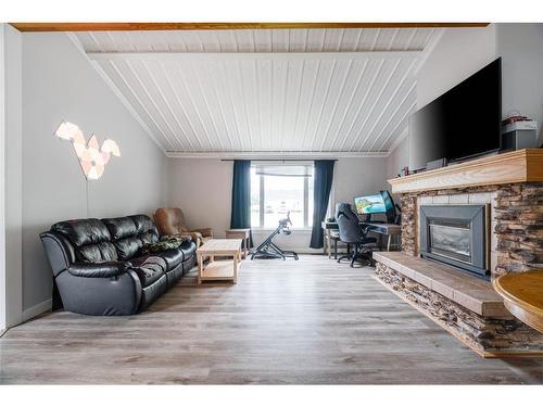 52 Poplar Crescent, Gregoire Lake Estates, AB - Indoor Photo Showing Living Room With Fireplace