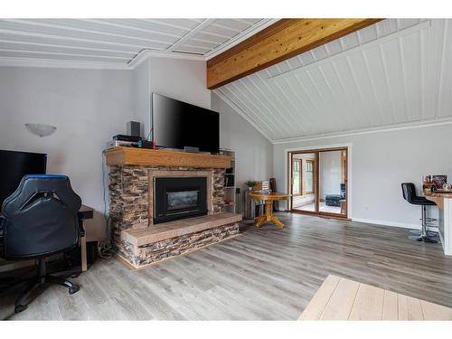 52 Poplar Crescent, Gregoire Lake Estates, AB - Indoor Photo Showing Living Room With Fireplace