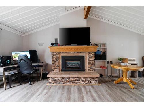 52 Poplar Crescent, Gregoire Lake Estates, AB - Indoor Photo Showing Living Room With Fireplace