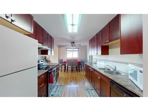 143 Hill Drive, Fort Mcmurray, AB - Indoor Photo Showing Kitchen With Double Sink