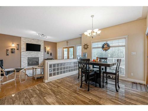 120 Philpott Bay, Fort Mcmurray, AB - Indoor Photo Showing Dining Room With Fireplace