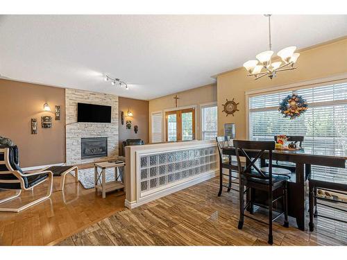 120 Philpott Bay, Fort Mcmurray, AB - Indoor Photo Showing Dining Room With Fireplace