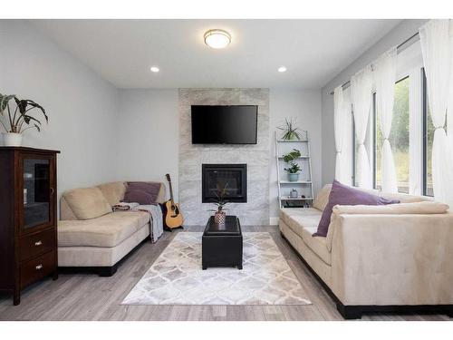 113 Garson Place, Fort Mcmurray, AB - Indoor Photo Showing Living Room With Fireplace