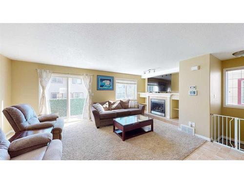 49-220 Swanson Crescent, Fort Mcmurray, AB - Indoor Photo Showing Living Room With Fireplace