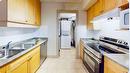 2108-38 Riedel Street, Fort Mcmurray, AB  - Indoor Photo Showing Kitchen With Double Sink 