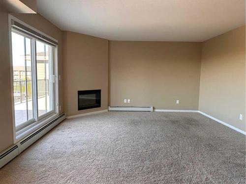 338-201 Abasand Drive, Fort Mcmurray, AB - Indoor With Fireplace