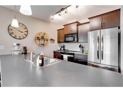 3114-135C Sandpiper Road, Fort Mcmurray, AB - Indoor Photo Showing Kitchen With Stainless Steel Kitchen With Double Sink With Upgraded Kitchen