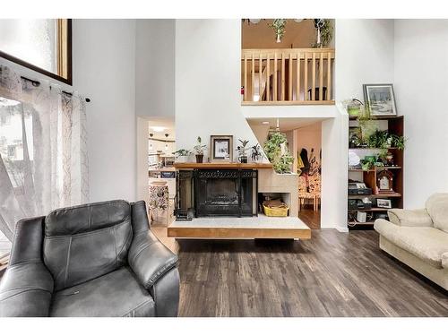 160 Cowley Bay, Fort Mcmurray, AB - Indoor Photo Showing Living Room With Fireplace