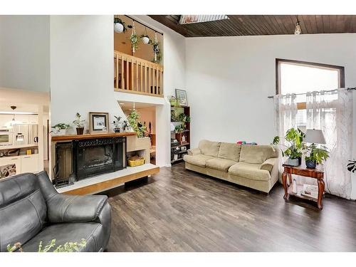 160 Cowley Bay, Fort Mcmurray, AB - Indoor Photo Showing Living Room With Fireplace