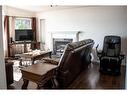 233 Barber Drive, Fort Mcmurray, AB  - Indoor Photo Showing Living Room With Fireplace 