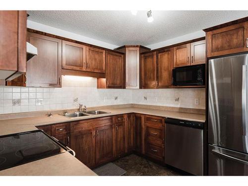 206 Carteret Drive, Fort Mcmurray, AB - Indoor Photo Showing Kitchen With Double Sink