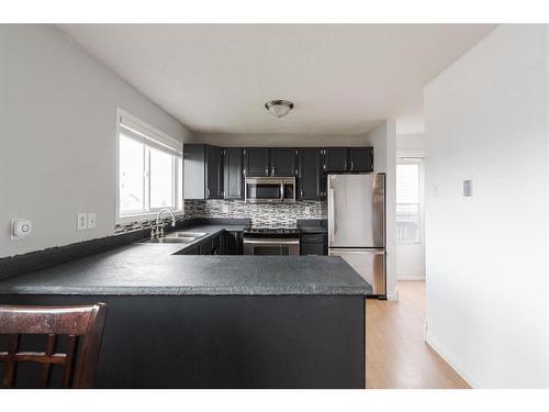 110 Leigh Crescent, Fort Mcmurray, AB - Indoor Photo Showing Kitchen With Stainless Steel Kitchen With Double Sink