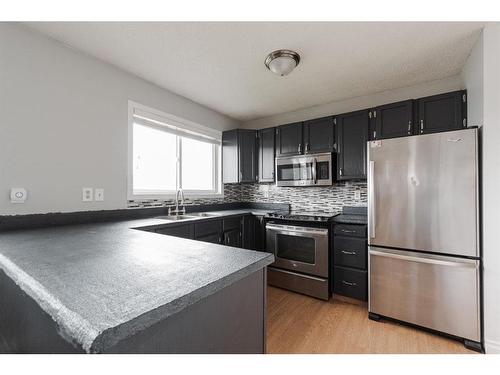 110 Leigh Crescent, Fort Mcmurray, AB - Indoor Photo Showing Kitchen With Stainless Steel Kitchen