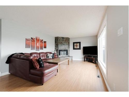 110 Leigh Crescent, Fort Mcmurray, AB - Indoor Photo Showing Living Room With Fireplace