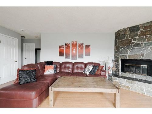 110 Leigh Crescent, Fort Mcmurray, AB - Indoor Photo Showing Living Room With Fireplace