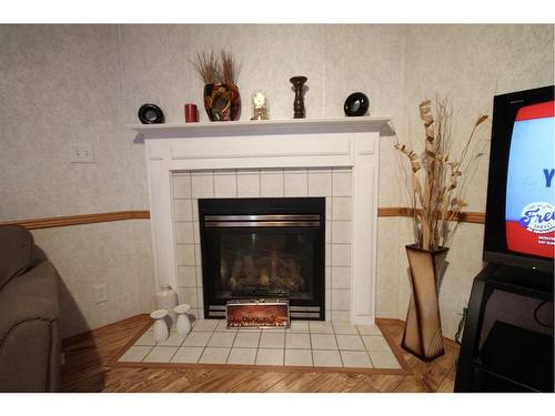 183 Grenoble Crescent, Fort Mcmurray, AB - Indoor Photo Showing Living Room With Fireplace