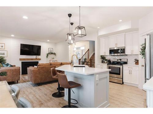 176 Mountain Avens Crescent, Fort Mcmurray, AB - Indoor Photo Showing Kitchen With Fireplace With Upgraded Kitchen