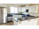 29-100 Millennium Gate, Fort Mcmurray, AB  - Indoor Photo Showing Kitchen With Stainless Steel Kitchen With Double Sink 