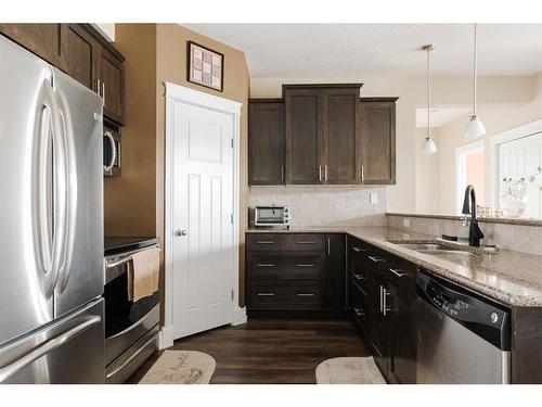 303-9919 Gordon Avenue, Fort Mcmurray, AB - Indoor Photo Showing Kitchen With Stainless Steel Kitchen With Double Sink With Upgraded Kitchen